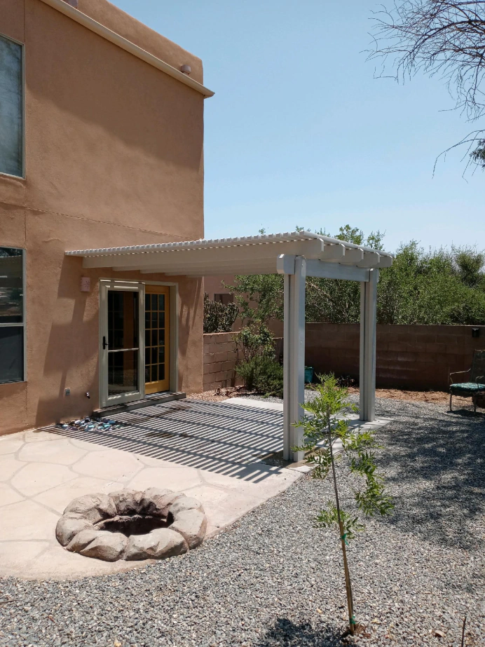Louvered aluminum pergola providing adjustable shade in an Albuquerque backyard