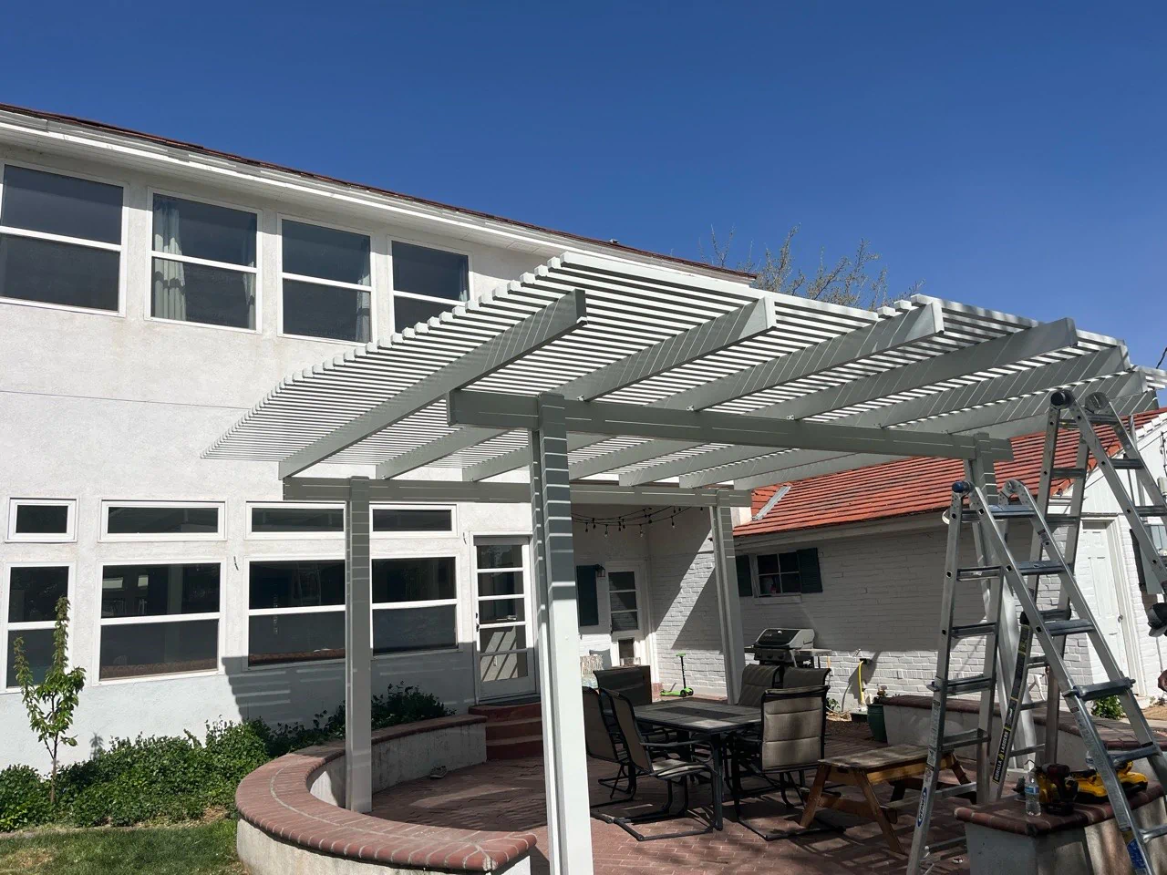 Aluminum flat pan patio cover installed on an Albuquerque backyard patio