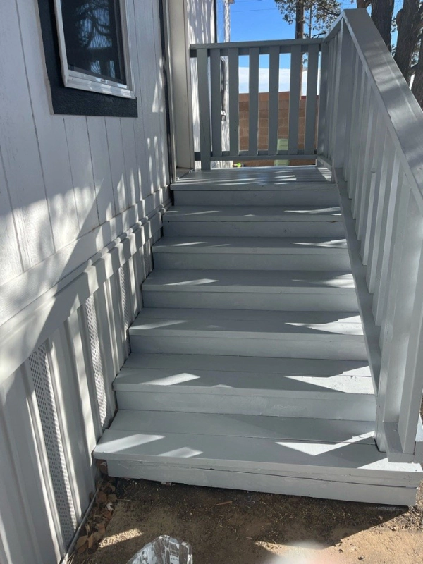 Custom backyard deck with built-in steps in Rio Rancho, NM