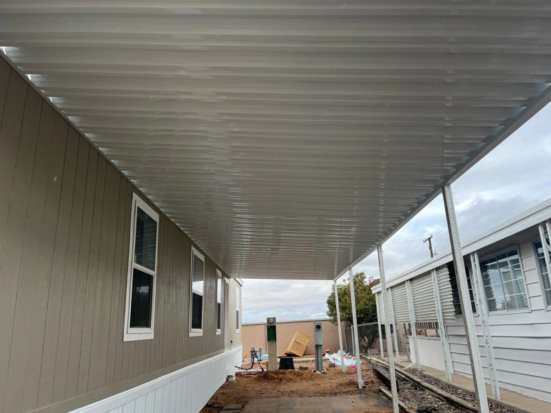 Aluminum flat pan patio cover shading a covered porch in Albuquerque