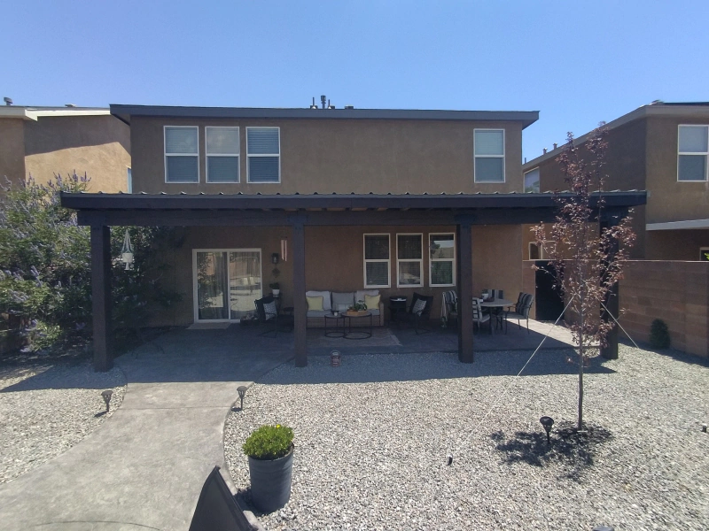 Solid wood patio cover over a backyard living space in Albuquerque