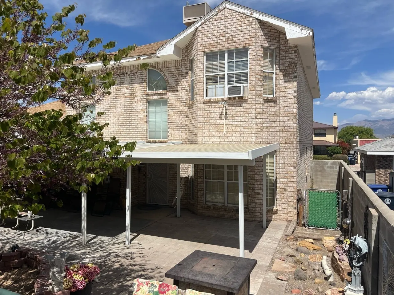 Aluminum flat pan patio cover with a natural wood-look finish in Albuquerque