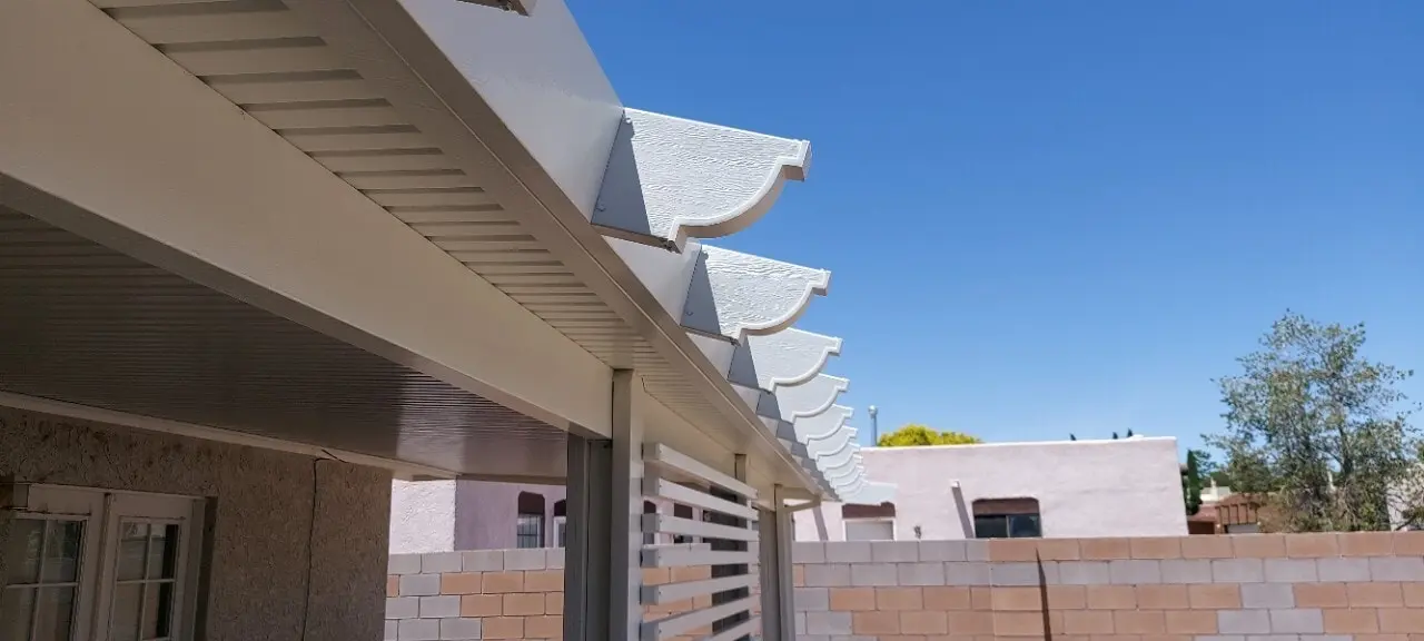 Aluminum patio cover with support posts over a concrete patio in Albuquerque, NM