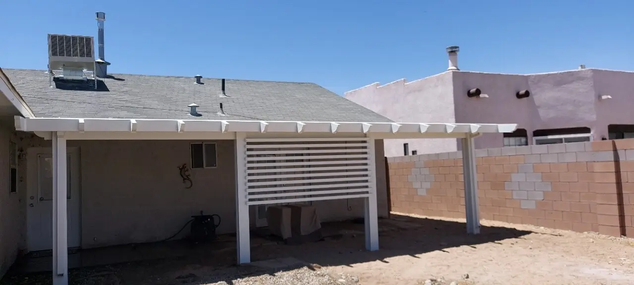 Aluminum patio cover creating a shaded outdoor living area in the North Valley