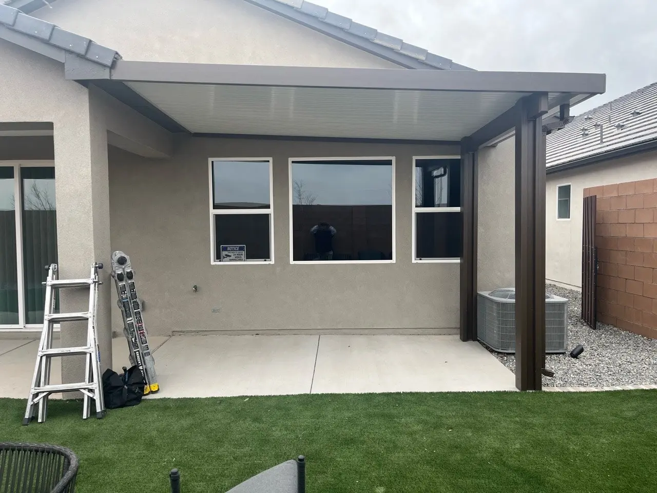 Aluminum flat pan patio cover shading a backyard patio in Albuquerque, NM